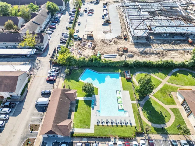 an aerial view of houses with yard