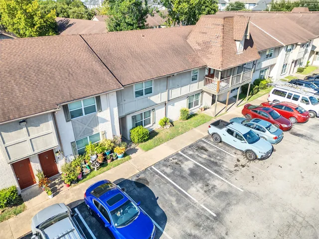 an aerial view of a house with a garden