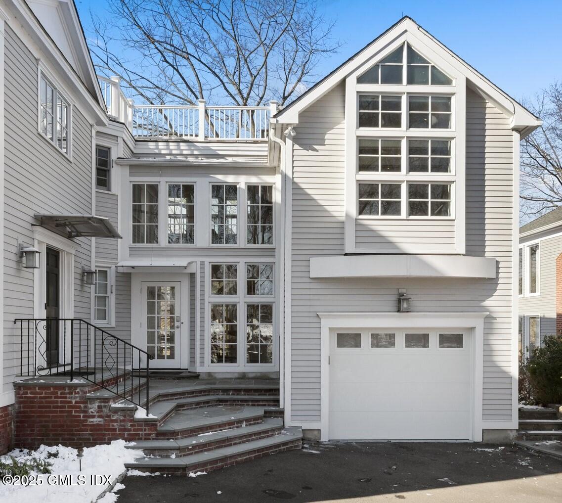 84 Indian Harbor Drive Greenwich, CT 06830 - Photo 1 of 16 a front view of a house with windows