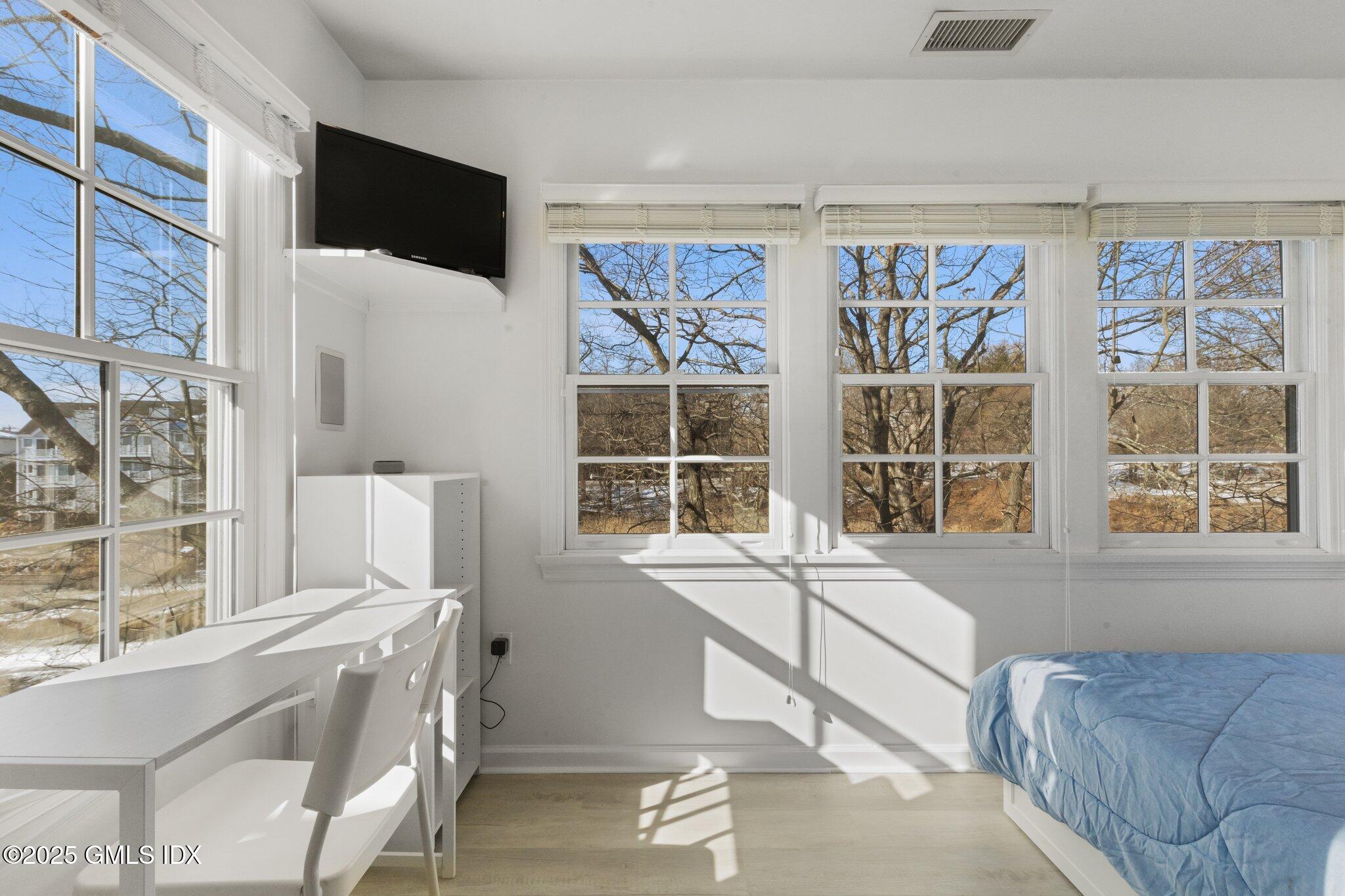84 Indian Harbor Drive Greenwich, CT 06830 - Photo 11 of 16 a living room with furniture and a large window