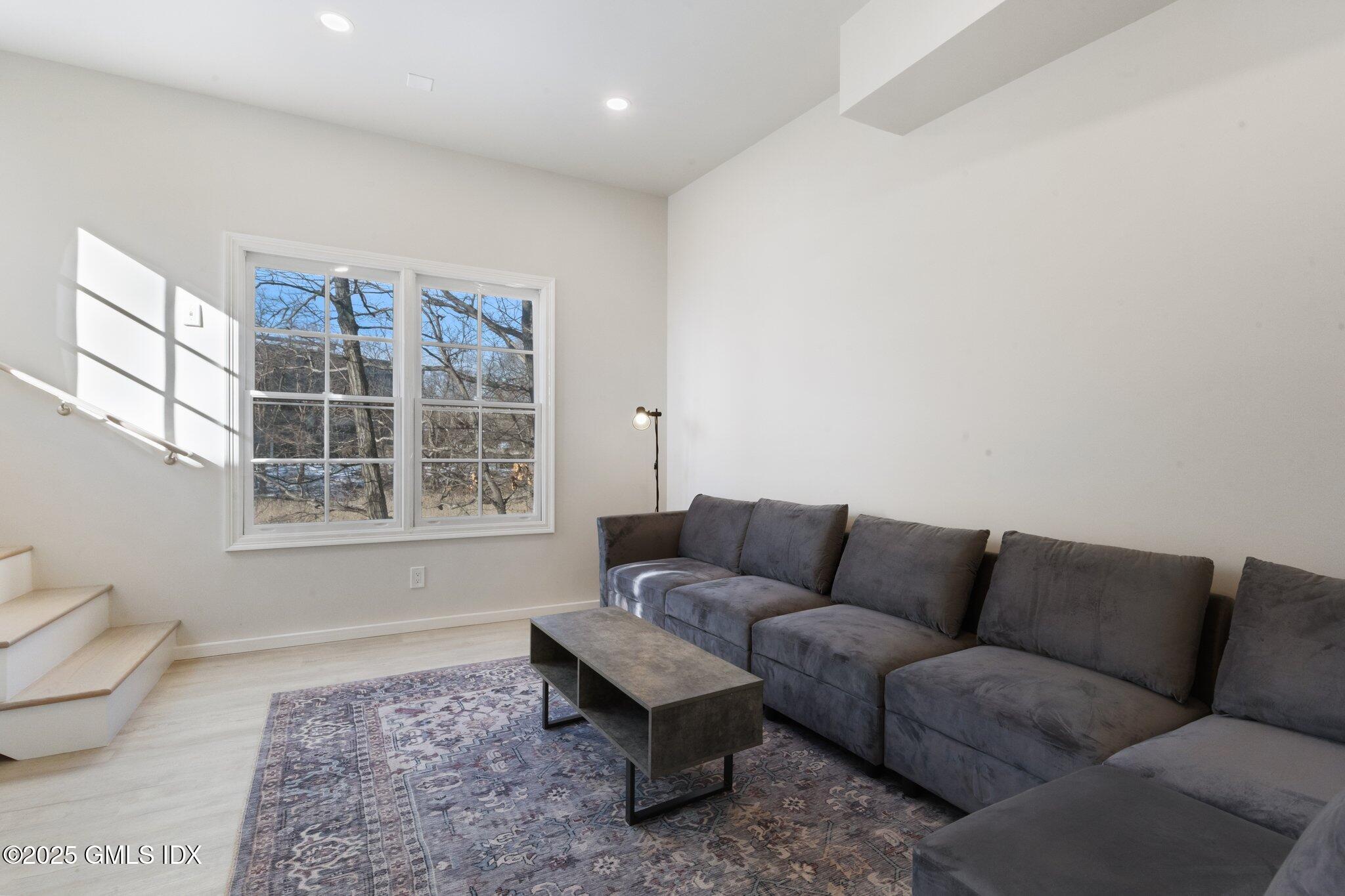 84 Indian Harbor Drive Greenwich, CT 06830 - Photo 13 of 16 a living room with furniture and a window