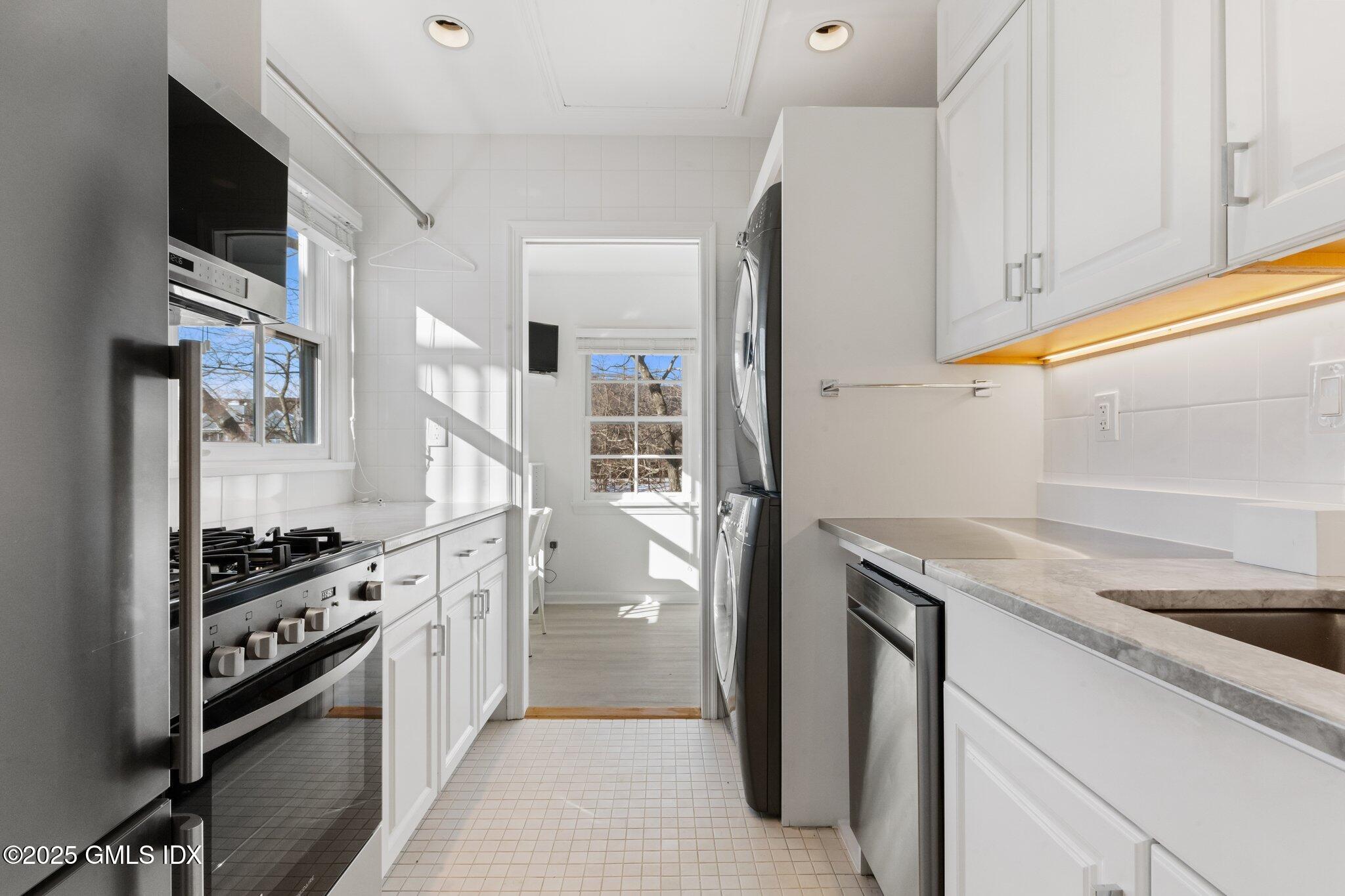 84 Indian Harbor Drive Greenwich, CT 06830 - Photo 5 of 16 a kitchen that has a sink and a stove