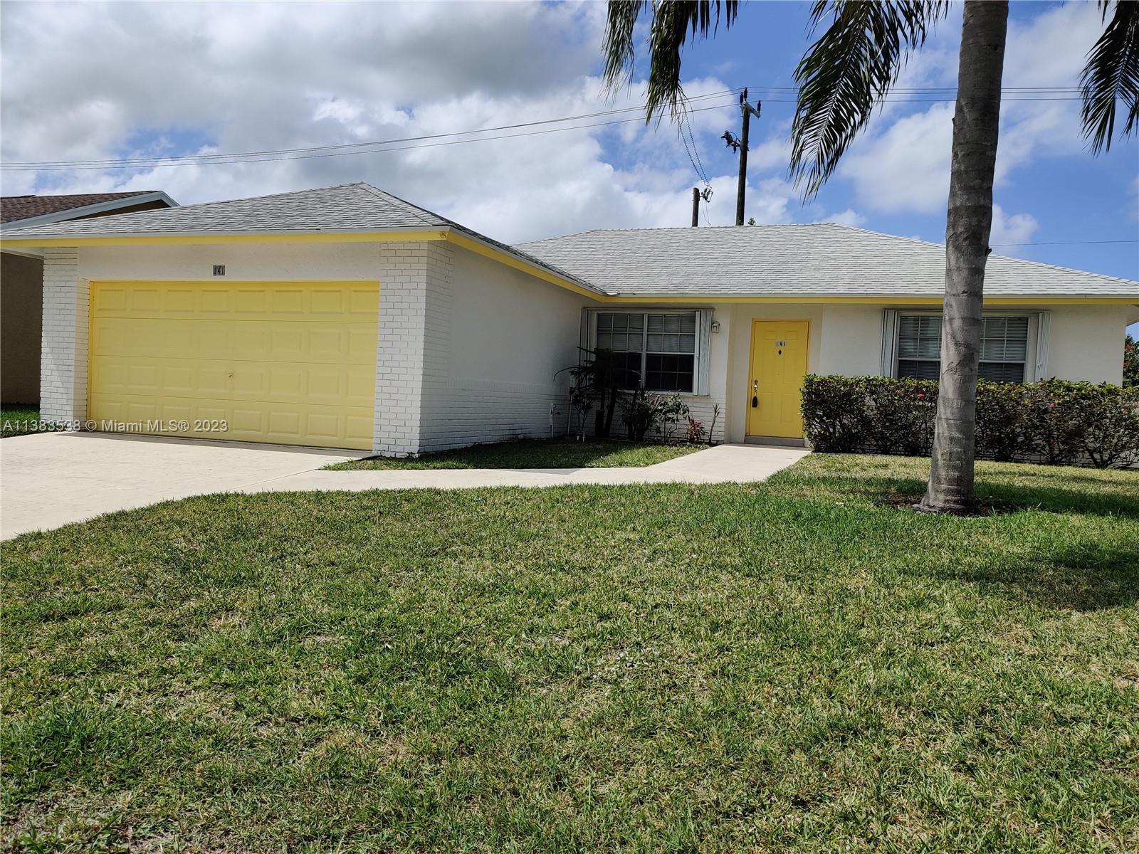 141 Arrowhead Circle Jupiter, FL 33458 - Photo 1 of 25 a view of a house with a yard