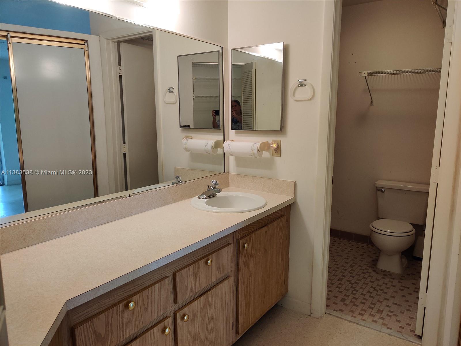 141 Arrowhead Circle Jupiter, FL 33458 - Photo 12 of 25 a bathroom with a sink a toilet and shower