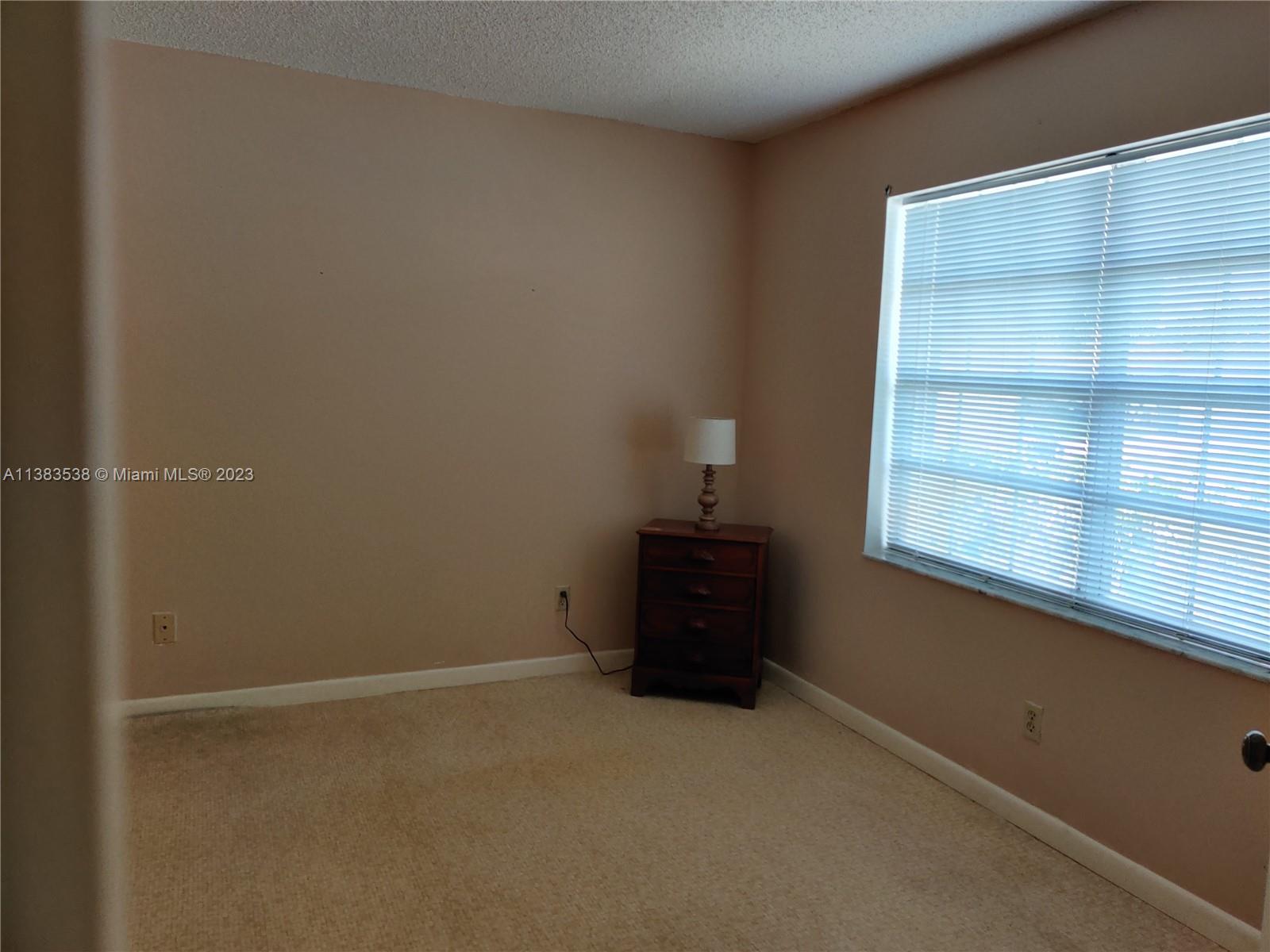 141 Arrowhead Circle Jupiter, FL 33458 - Photo 15 of 25 an empty room with a window