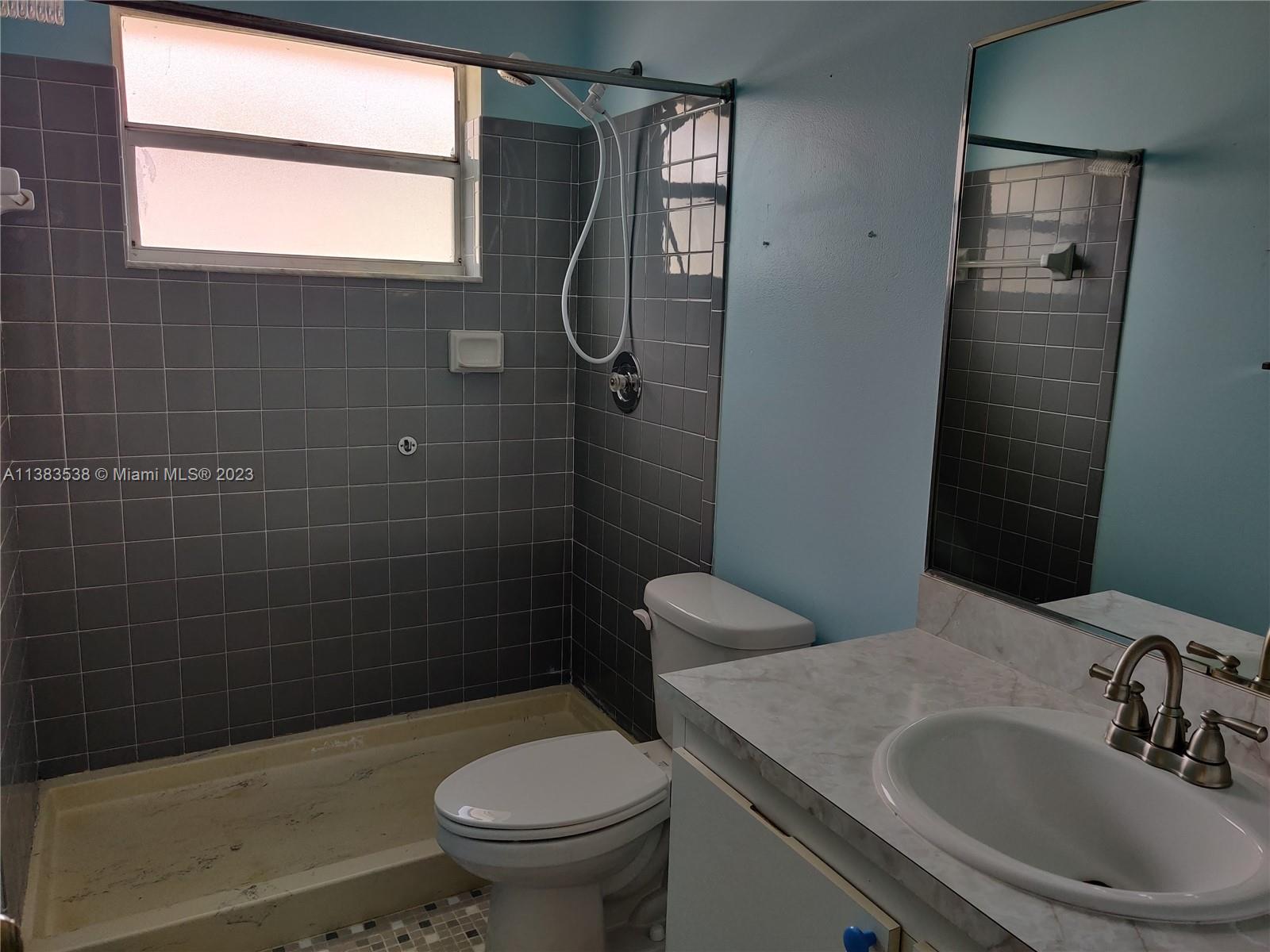 141 Arrowhead Circle Jupiter, FL 33458 - Photo 17 of 25 a bathroom with a sink a toilet and shower