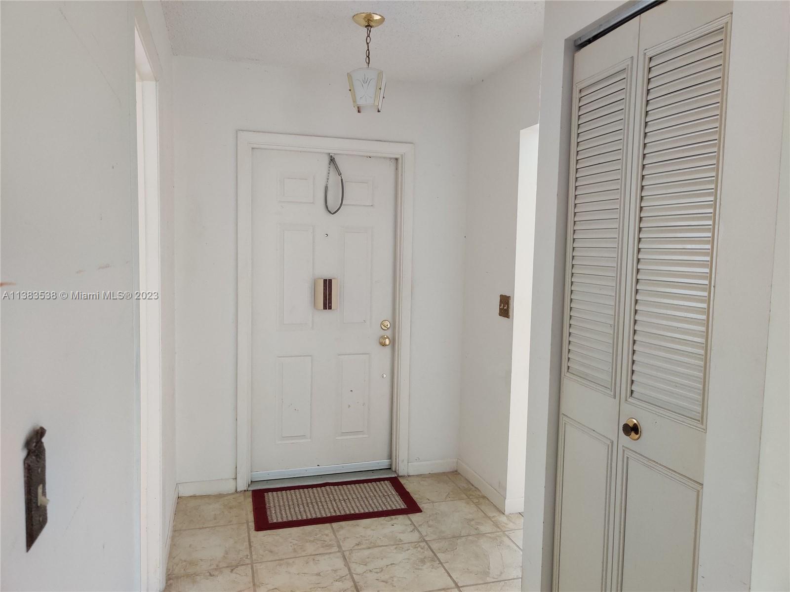 141 Arrowhead Circle Jupiter, FL 33458 - Photo 18 of 25 a view of a hallway to rooms