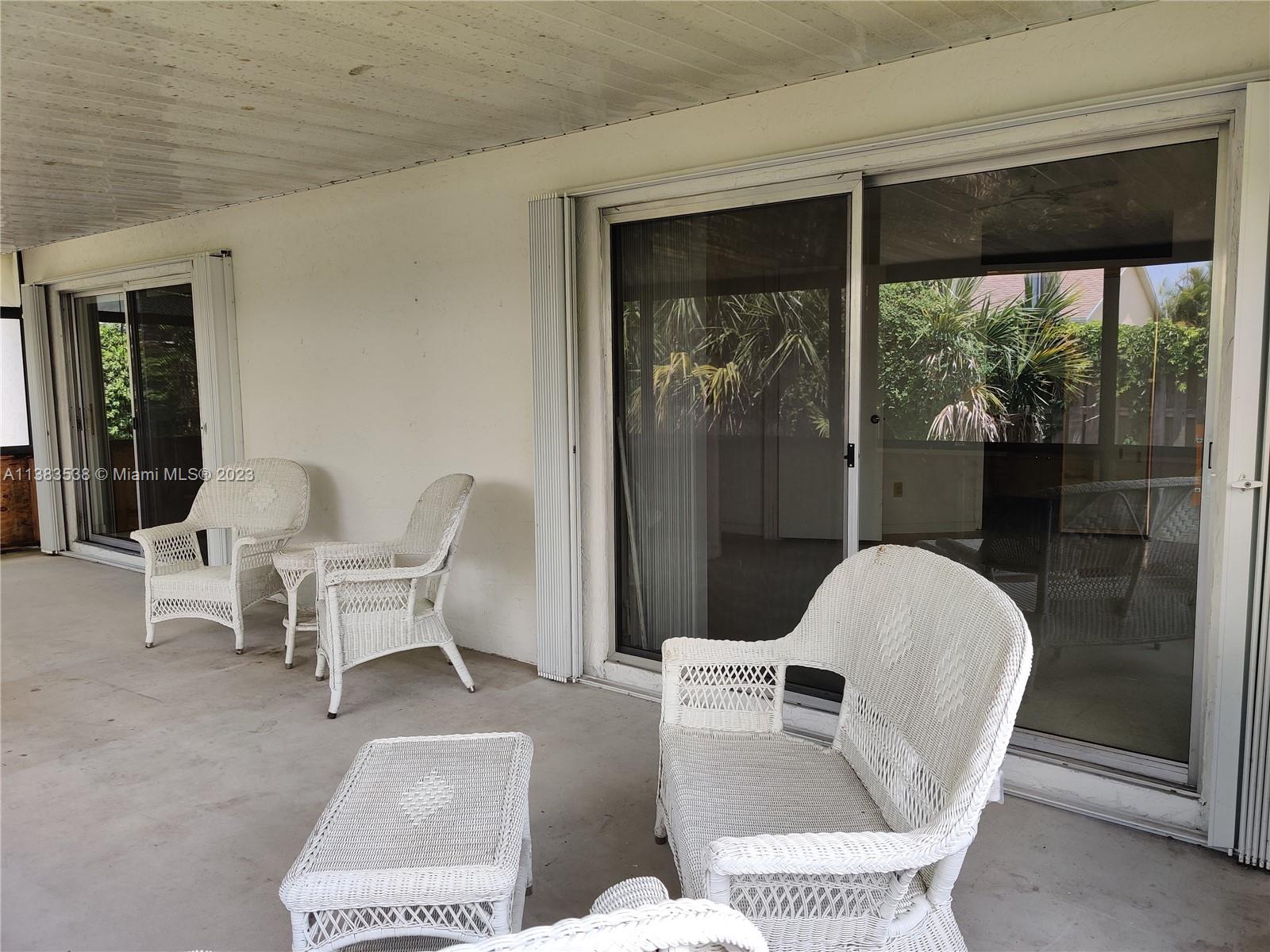 141 Arrowhead Circle Jupiter, FL 33458 - Photo 20 of 25 a living room with furniture and a large window