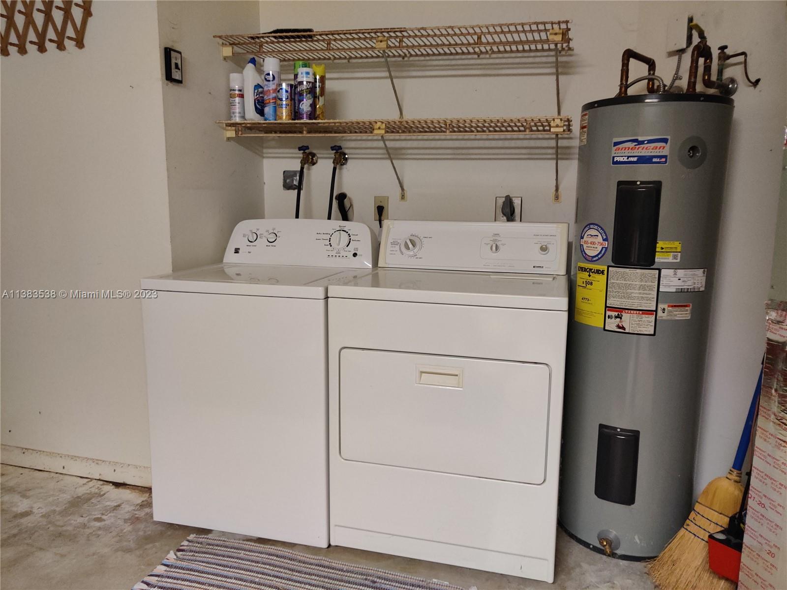 141 Arrowhead Circle Jupiter, FL 33458 - Photo 25 of 25 a utility room with dryer and washer