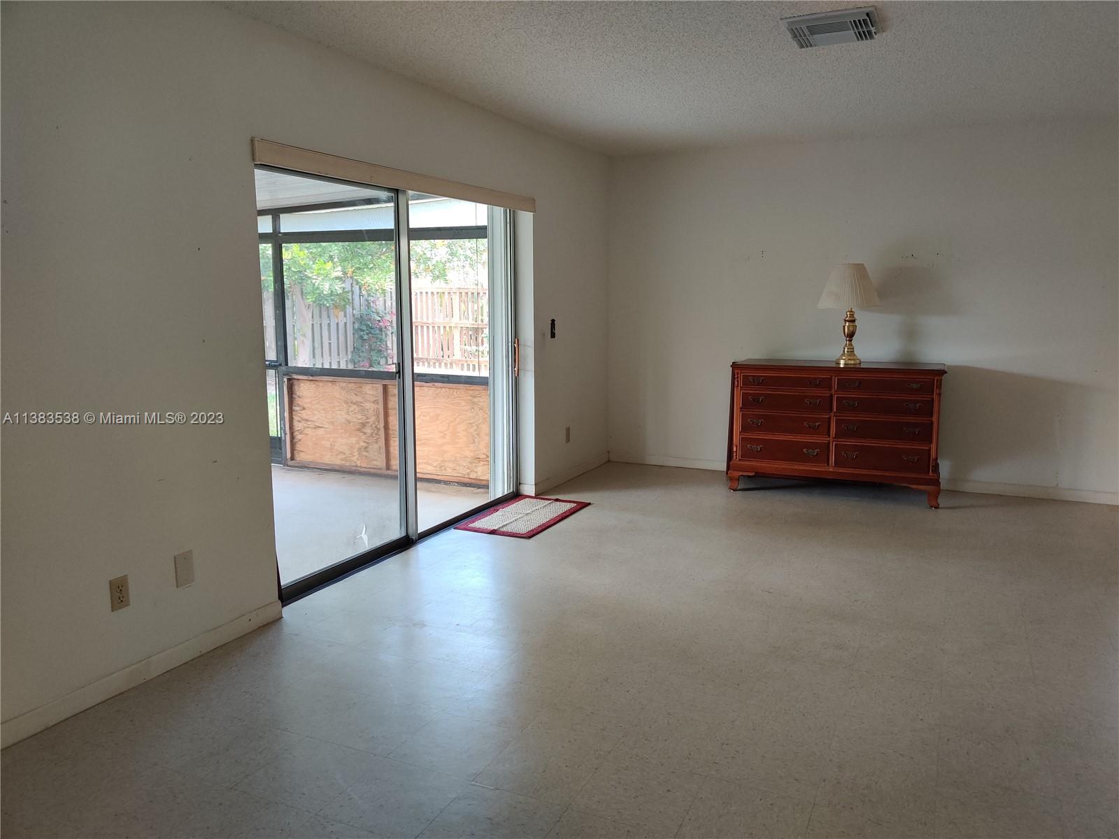 141 Arrowhead Circle Jupiter, FL 33458 - Photo 4 of 25 an empty room with windows