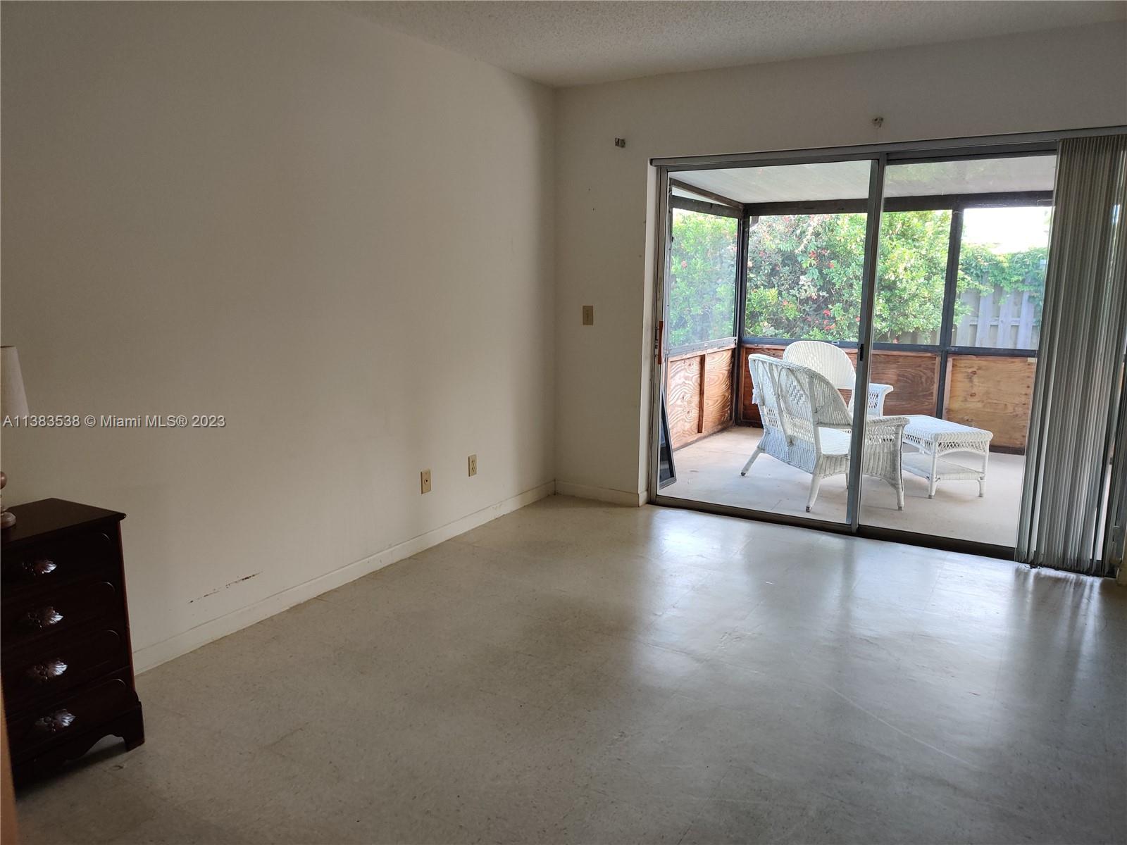 141 Arrowhead Circle Jupiter, FL 33458 - Photo 10 of 25 a view of livingroom with furniture and floor to ceiling window