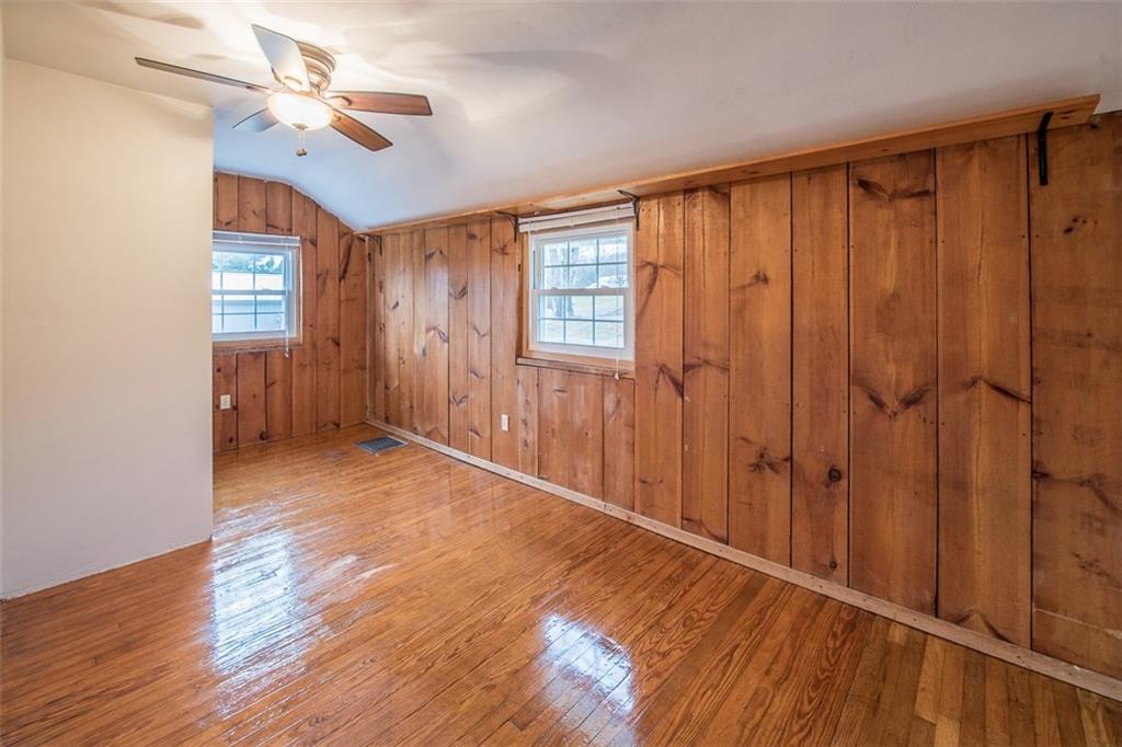 611 Blue Ridge Drive Apollo, PA 15613 - Photo 11 of 25 Third bedroom with cedar panel accents and bright and shiny flooring.