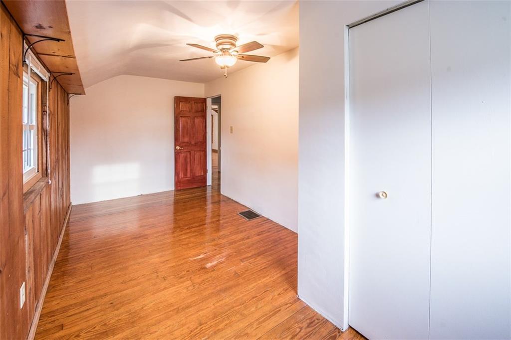 611 Blue Ridge Drive Apollo, PA 15613 - Photo 12 of 25 Third bedroom with ceiling fan, closet and window treatments.