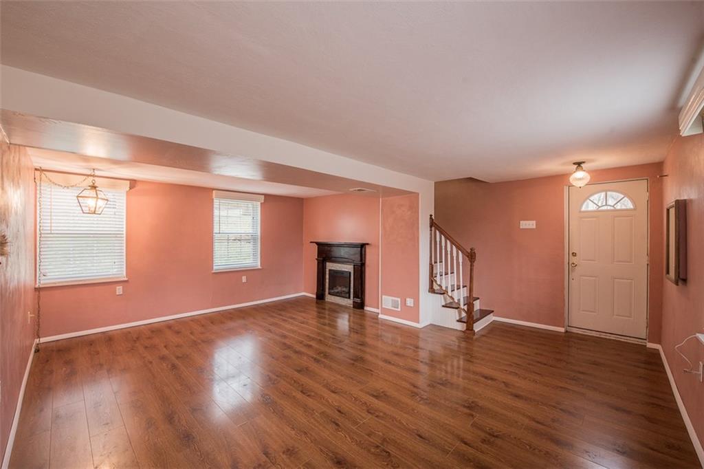 611 Blue Ridge Drive Apollo, PA 15613 - Photo 3 of 25 Glistening floors and fireplace welcome your family and friends.
