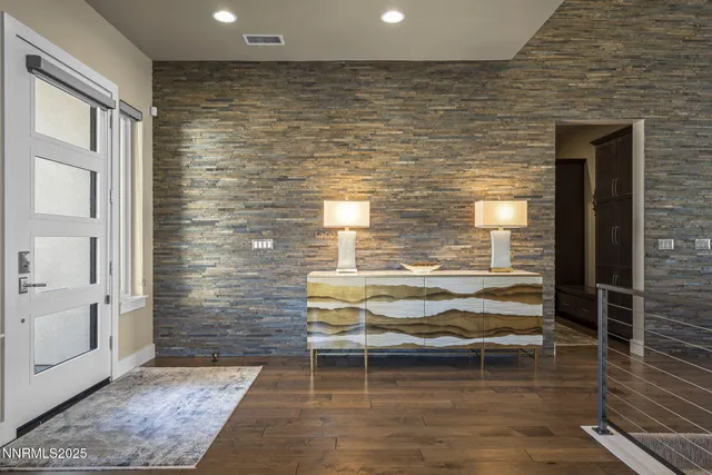 a large kitchen with a table and chairs in it