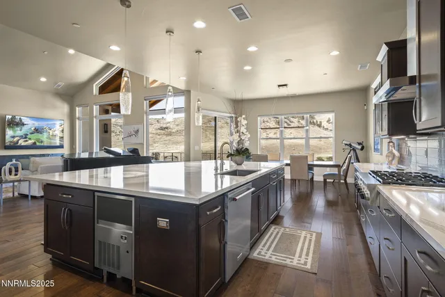 a bathroom with a sink mirror and shower