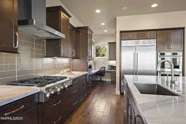 a spacious bathroom with a granite countertop sink and a mirror