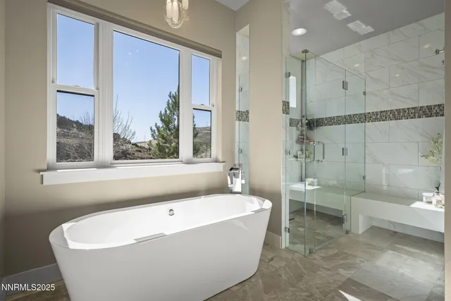 a bed room with furniture and a chandelier