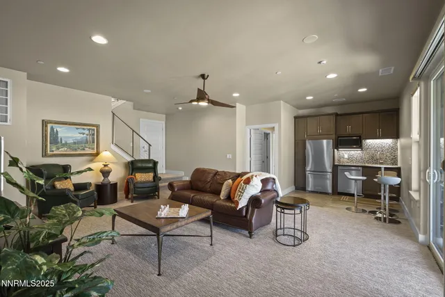 a view of living room with furniture and wooden floor