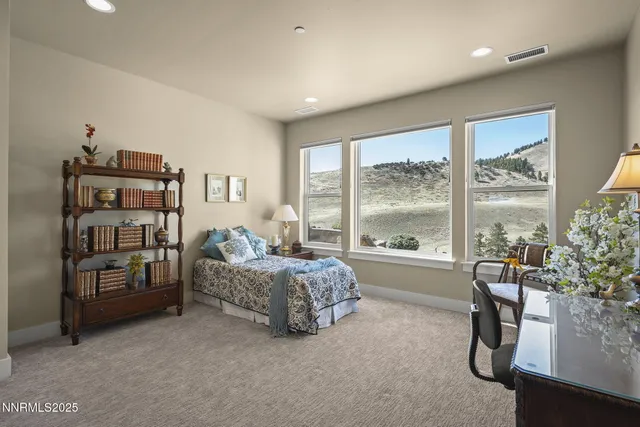 an aerial view of houses with a yard