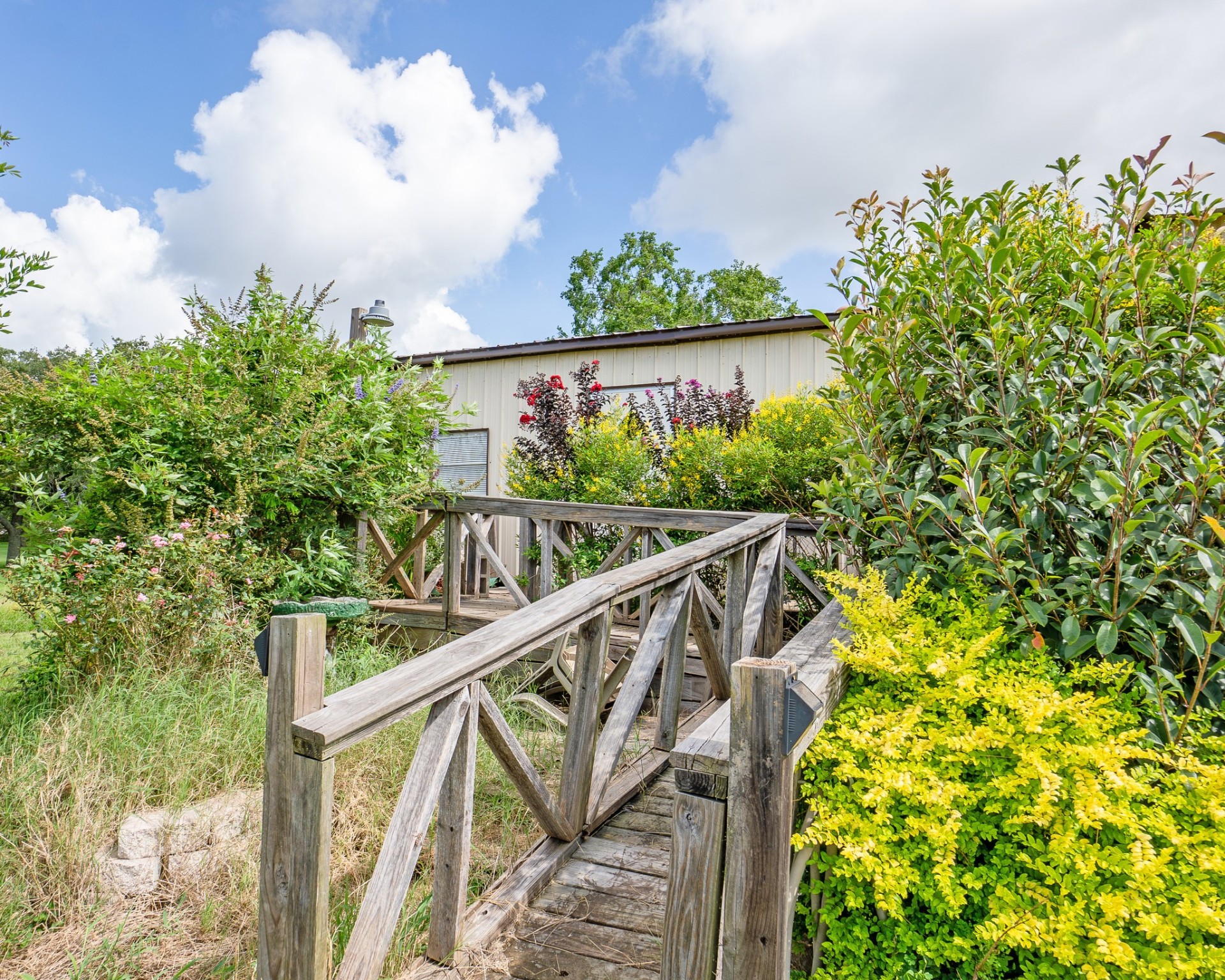 214 Williams Road Bay City, TX 77414 - Photo 12 of 48 a view of a house with a flower garden