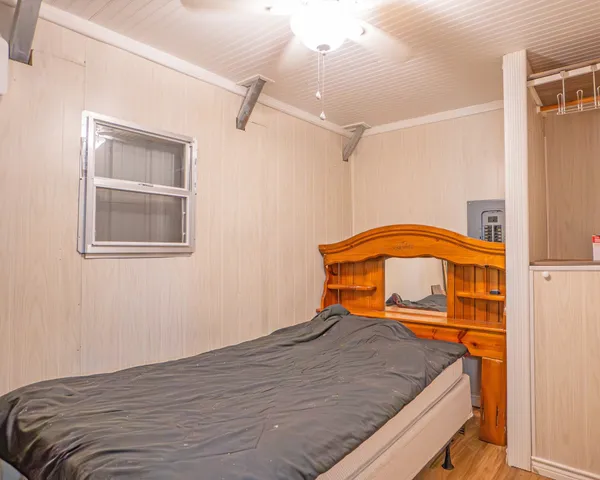 a bathroom with a sink a toilet a mirror and shower curtain