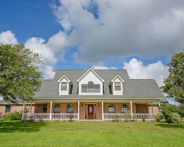 front view of a house with a garden