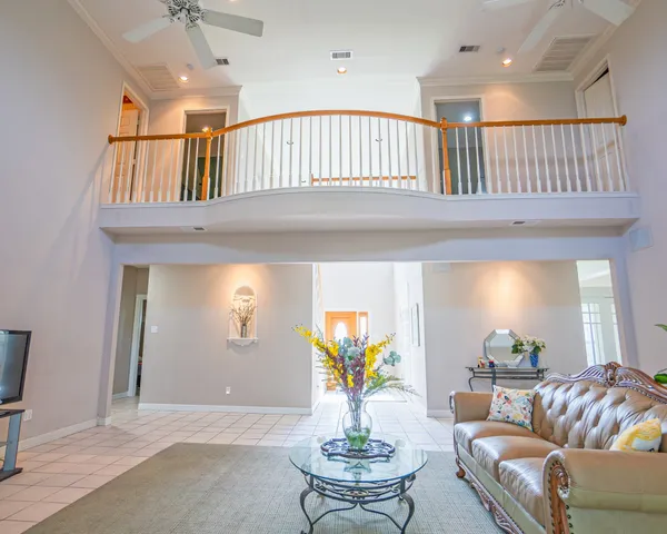 a living room with furniture and a table