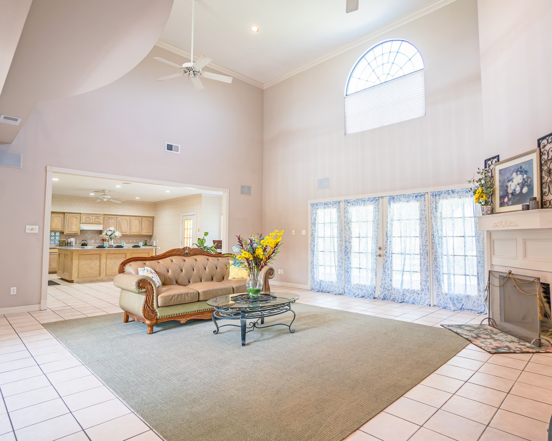 214 Williams Road Bay City, TX 77414 - Photo 24 of 48 a living room with furniture a fireplace and a floor to ceiling window