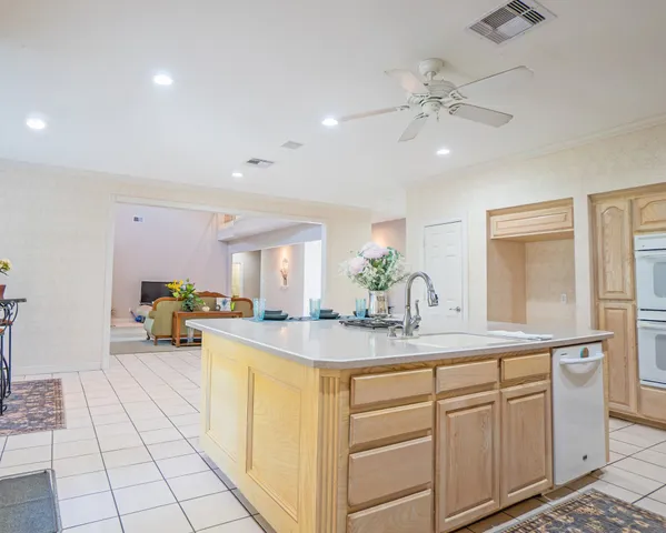a kitchen with stainless steel appliances granite countertop a sink and cabinets