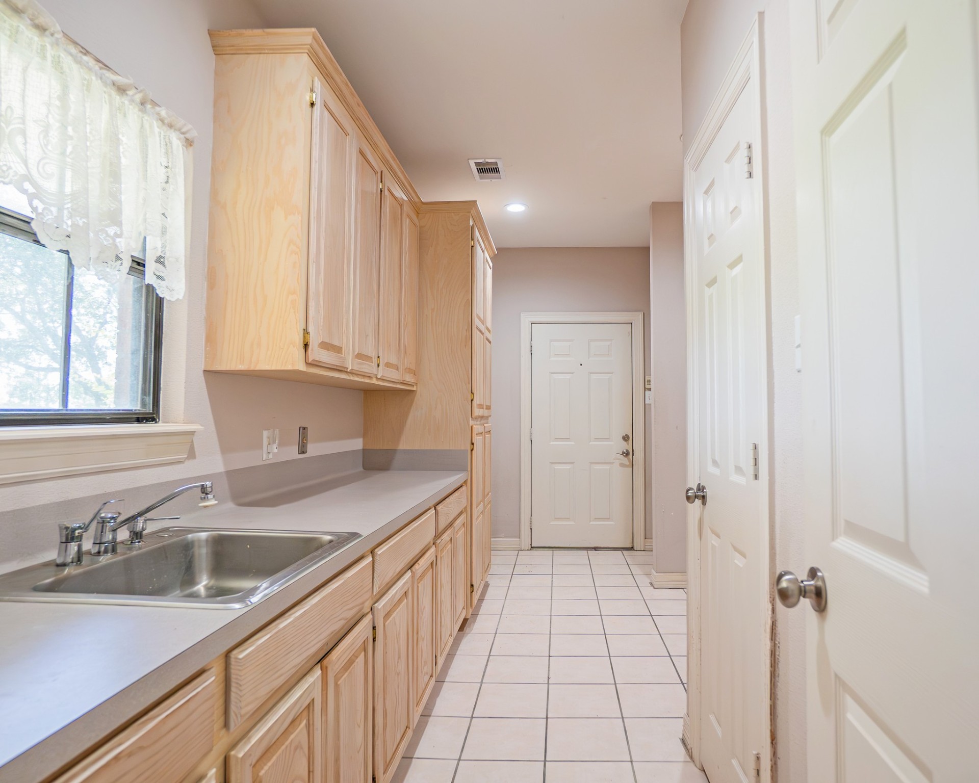 214 Williams Road Bay City, TX 77414 - Photo 35 of 48 a kitchen with a sink and cabinets