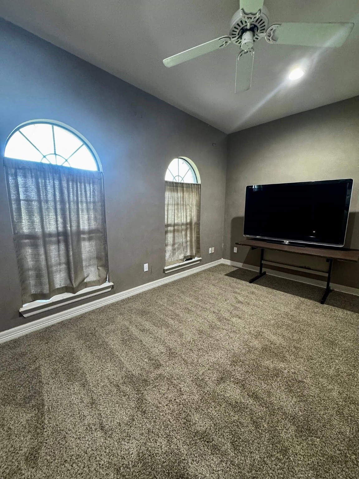 214 Williams Road Bay City, TX 77414 - Photo 45 of 48 en empty room with fan and windows