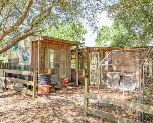 a view of a house with a tree