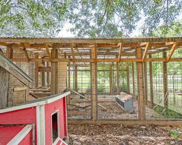 a view of a house with backyard porch and sitting area