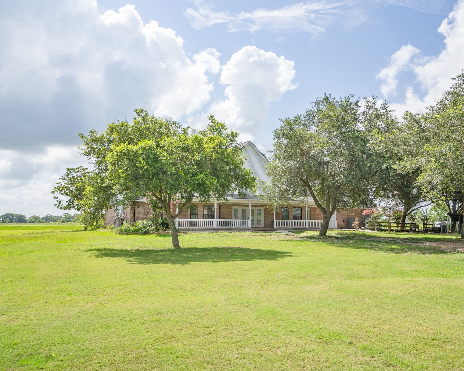 214 Williams Road Bay City, TX 77414 - Photo 9 of 48 a front view of a building with trees in the background