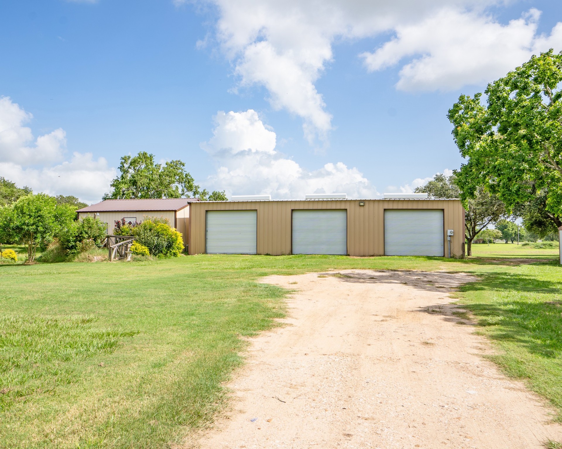 214 Williams Road Bay City, TX 77414 - Photo 10 of 48 a front view of a house with a yard and garage
