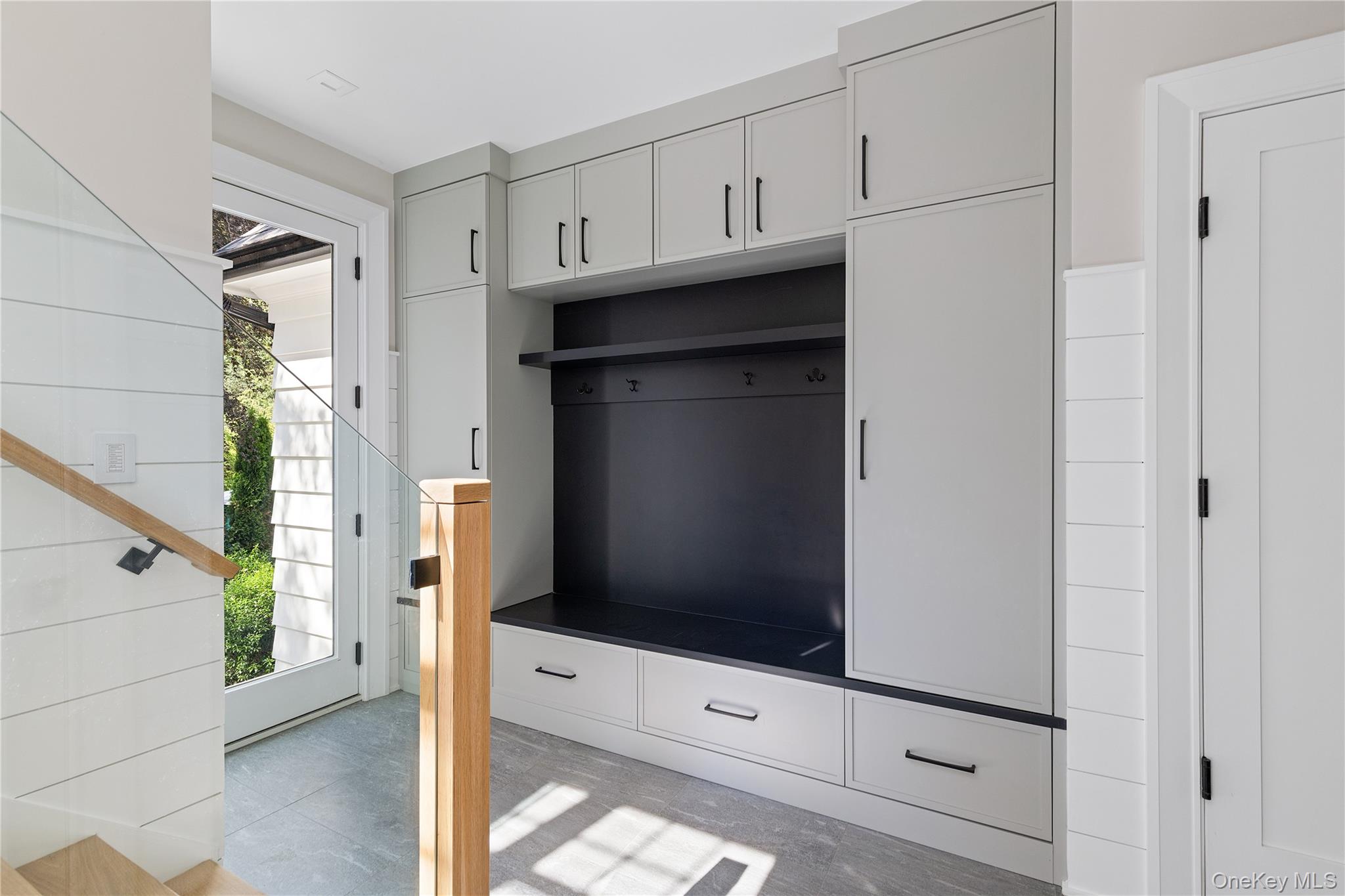 42 Mamaroneck Road Scarsdale, NY 10583 - Photo 27 of 47 The custom mudroom offers built-in seating, abundant storage, and a practical everyday drop zone designed to keep life beautifully organized.