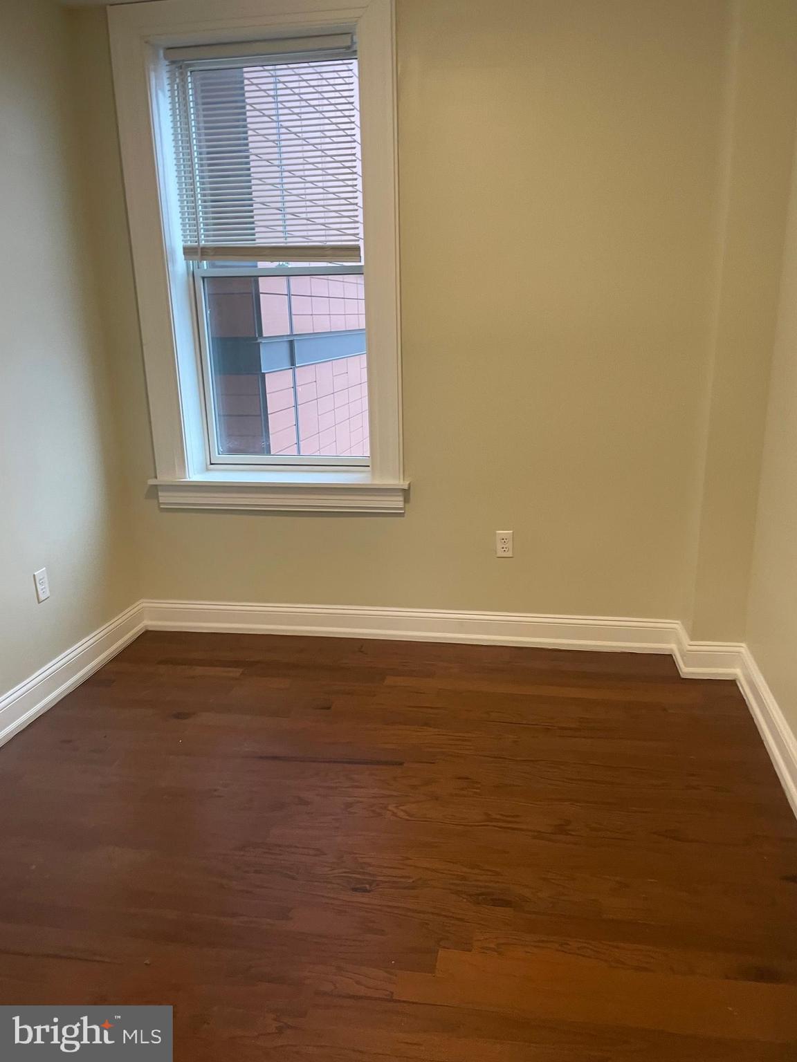 306 Cooper Street, Unit 505 Camden, NJ 08102 - Photo 11 of 19 a view of a room with wooden floor and a window