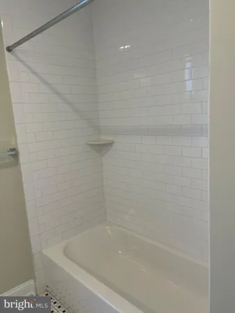 a close up of a bathtub curtain