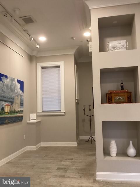 306 Cooper Street, Unit 505 Camden, NJ 08102 - Photo 4 of 19 a view of livingroom with furniture and wooden floor