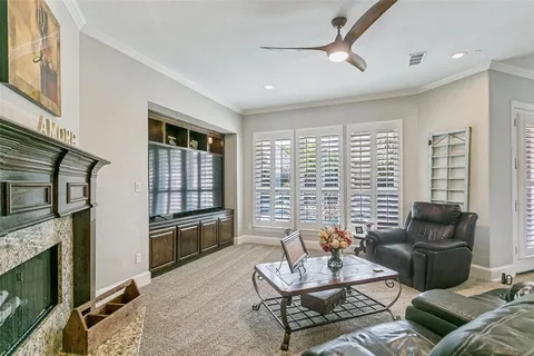 a kitchen with stainless steel appliances granite countertop a stove top oven a sink a dining table and chairs