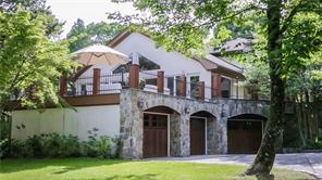 127 Horseshoe Hill Road Pound Ridge, NY 10576 - Photo 1 of 1 a front view of a house with garden