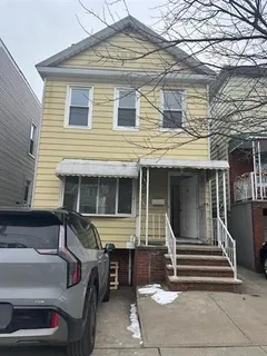 a front view of a house with stairs