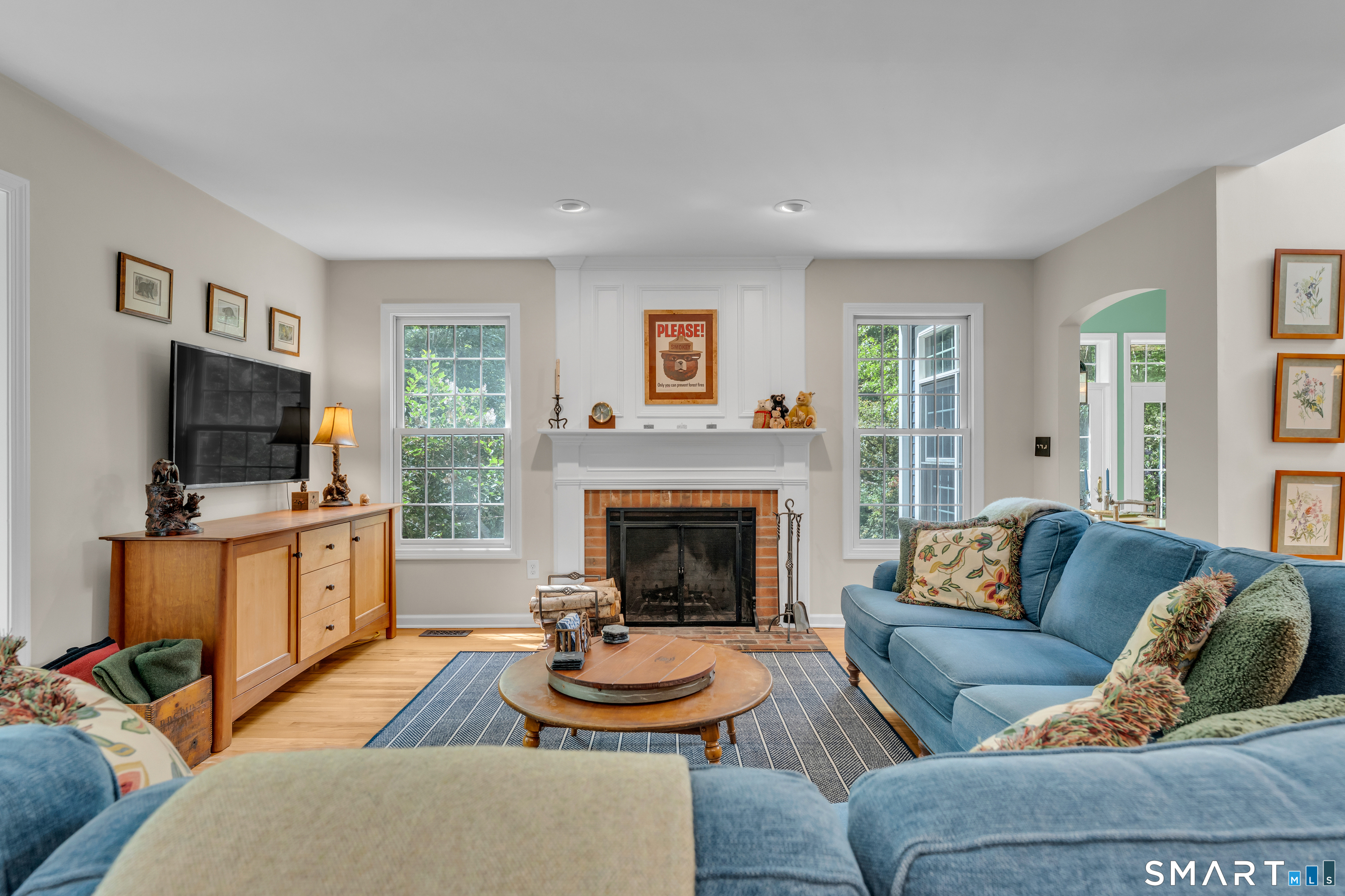 46 Laurel Cliffs Road Guilford, CT 06437 - Photo 6 of 40 This Family Room says sit back, relax and stay awhile! Fireplace and views of the yard make it extra special.