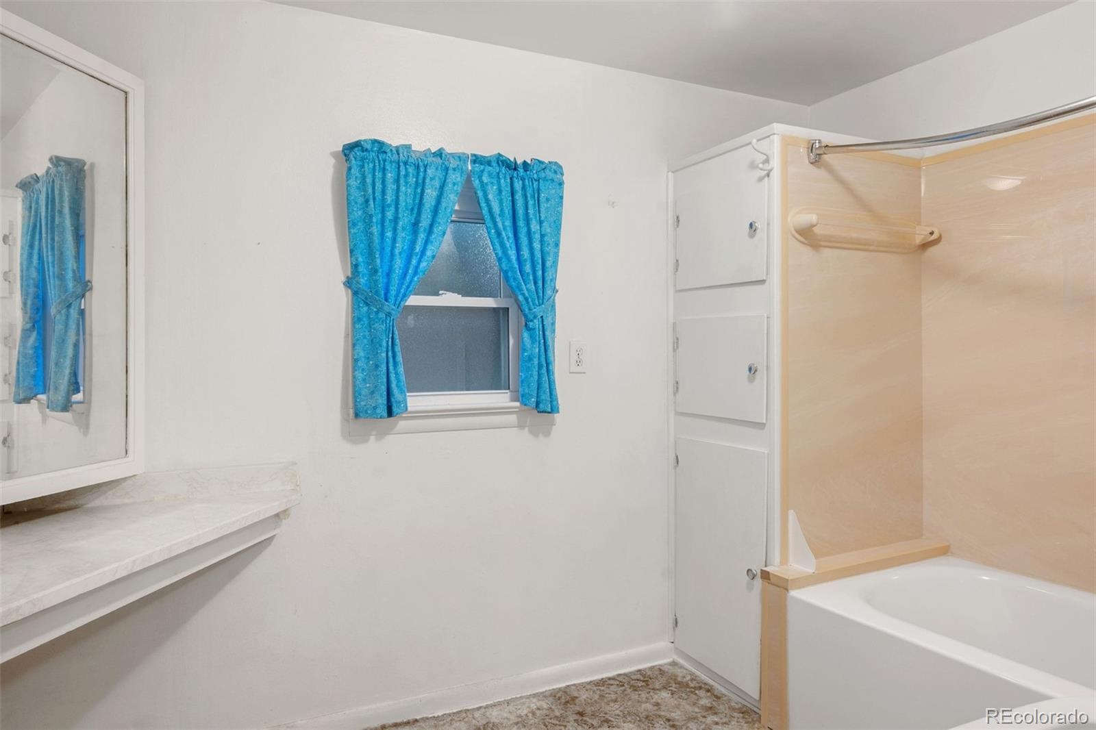 101 3rd Street Ramah, CO 80832 - Photo 12 of 24 a bathroom with a bathtub and a shower