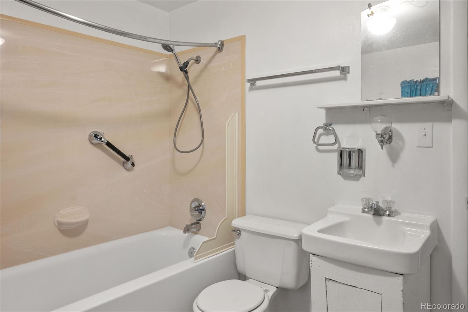 101 3rd Street Ramah, CO 80832 - Photo 13 of 24 a bathroom with a sink toilet and shower