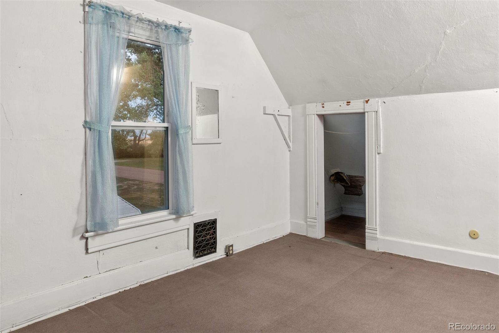 101 3rd Street Ramah, CO 80832 - Photo 17 of 24 an empty room with a bathroom and mirror