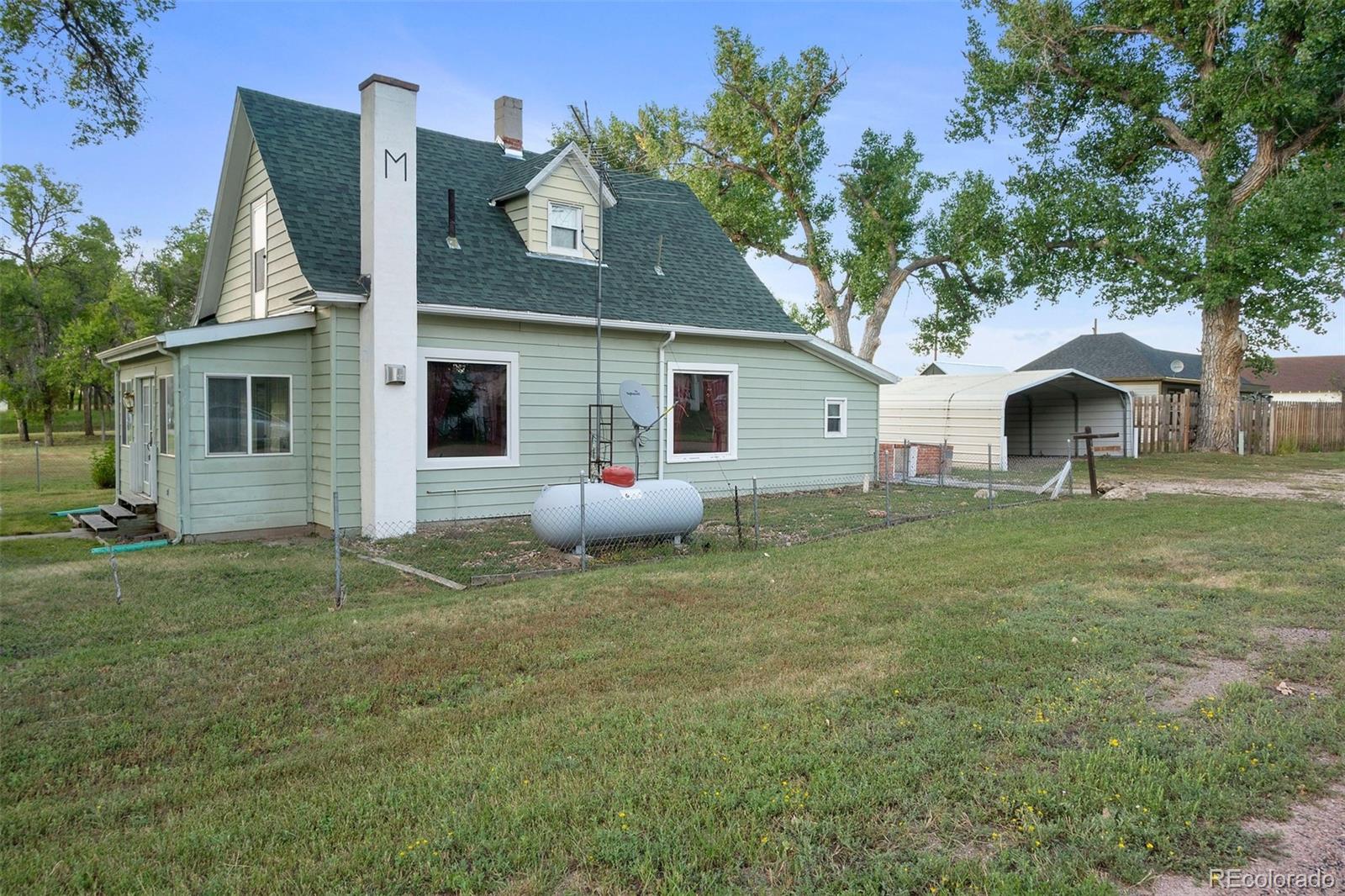 101 3rd Street Ramah, CO 80832 - Photo 19 of 24 a view of a house with a yard