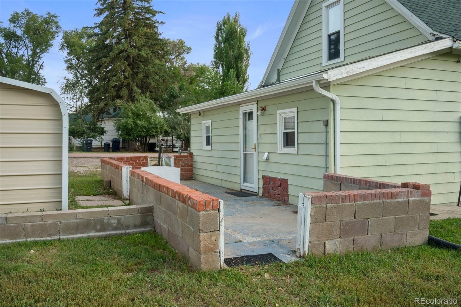 101 3rd Street Ramah, CO 80832 - Photo 21 of 24 a view of a backyard with sitting area