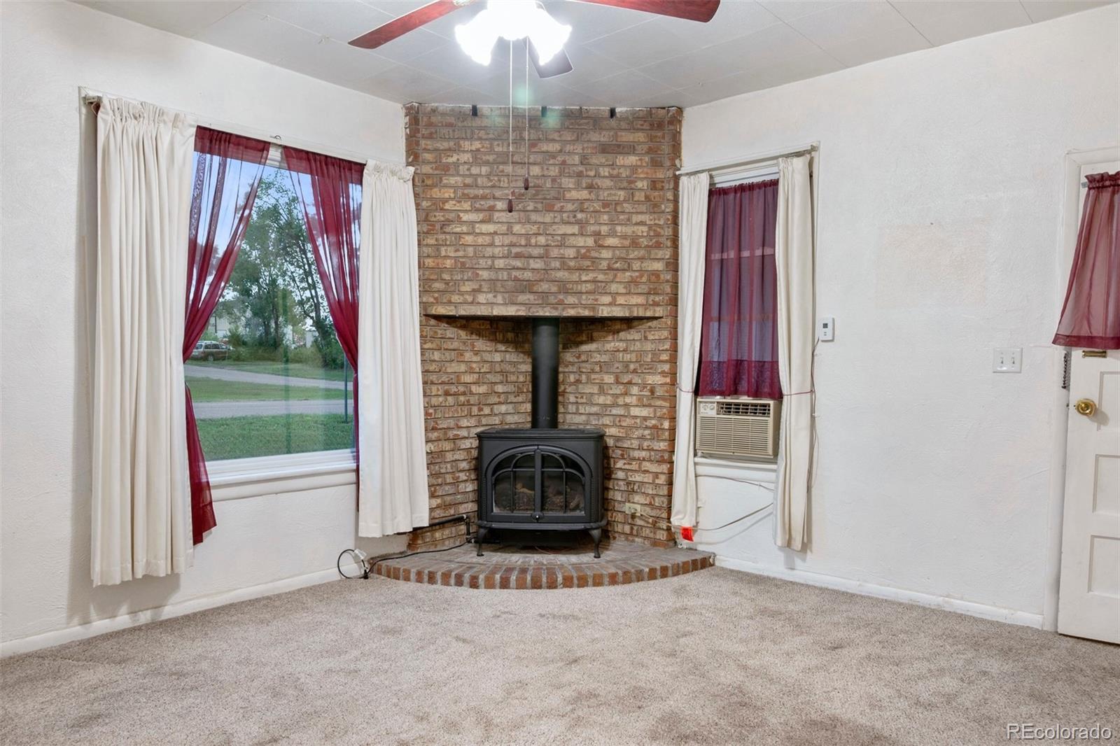 101 3rd Street Ramah, CO 80832 - Photo 3 of 24 a living room with furniture and a fireplace